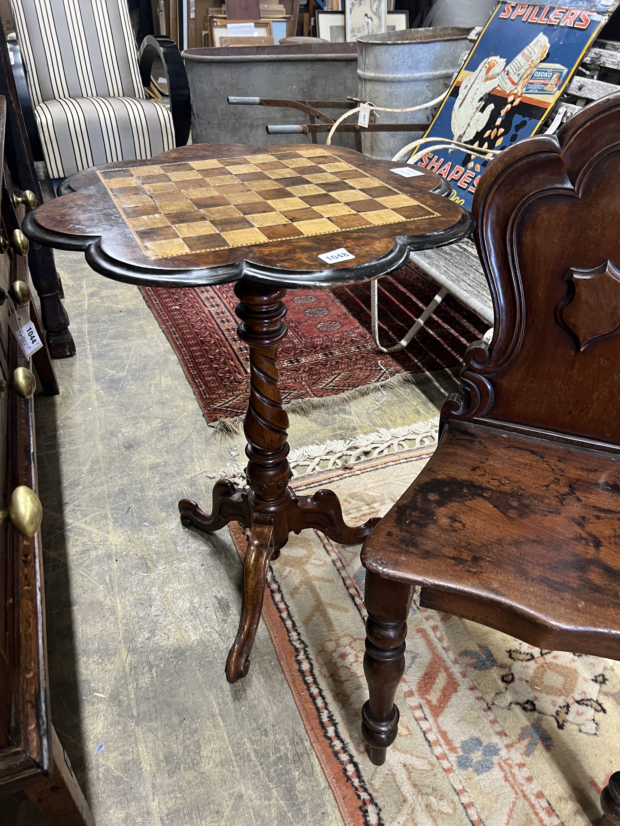 A Victorian mahogany hall chair and a Victorian walnut tripod games table, width 56cm, height 73cm